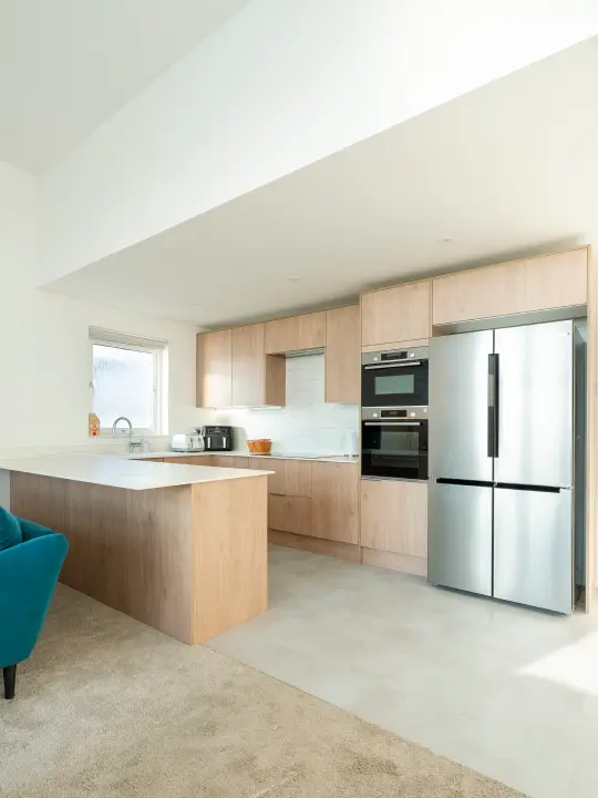 Professional kitchen renovation with modern appliances and custom cabinetry showcasing expert craftsmanship